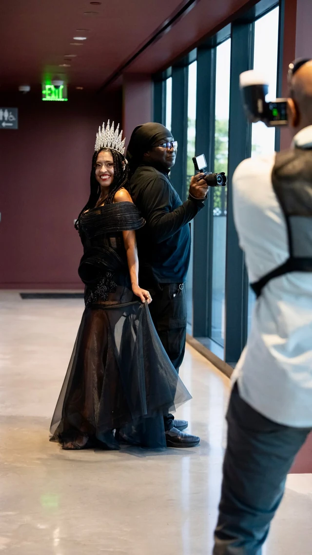 A behind-the-scenes reel cover of Markeith photographing a woman in a crown and gown